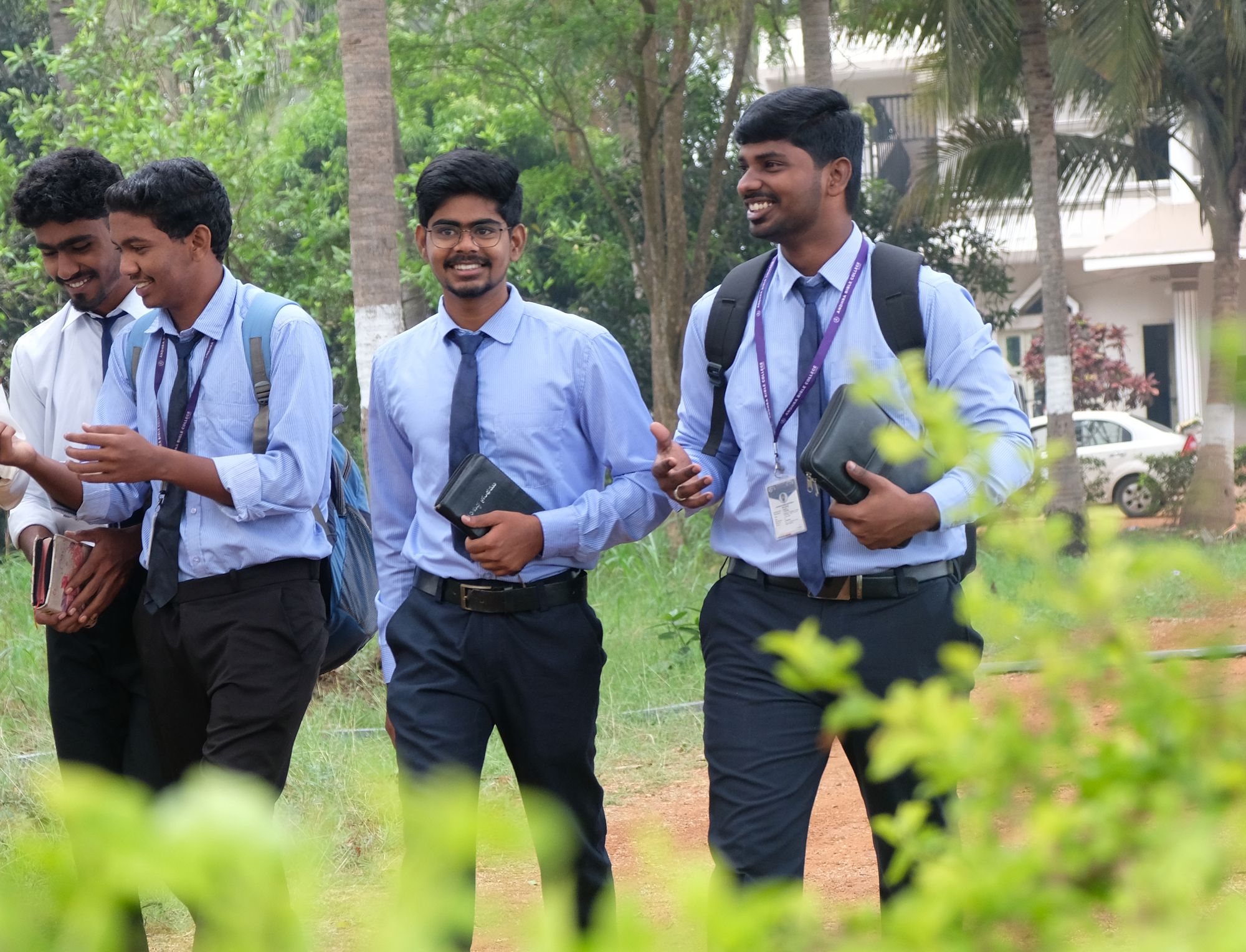 ABC students walking to class across the palm-lined campus