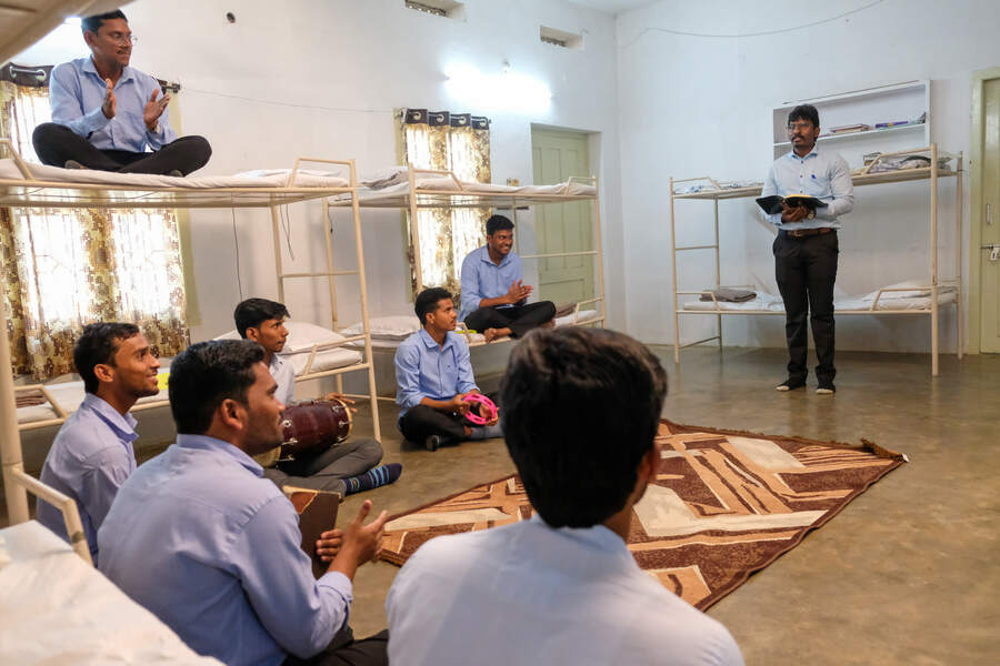Students gathered for devotions in a residence hall
